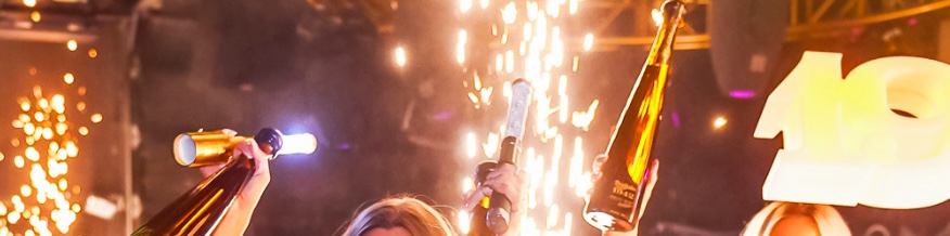 hands holding bottles in the air